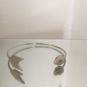 Silver colored arrow bangle bracelet